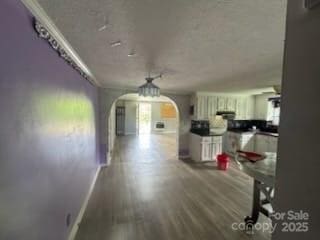 127 Hill St, Mooresboro, NC 28114 - dining area with arched walkways and wood finished floors