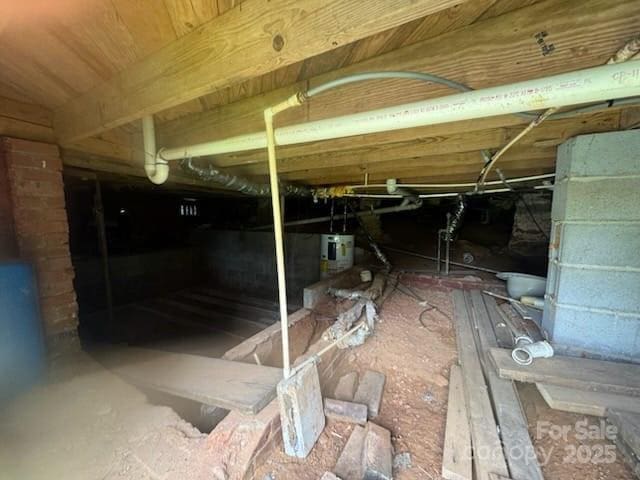 127 Hill St, Mooresboro, NC 28114 - inside crawl space featuring water heater