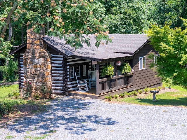 225 Wilderness Rd, Tryon, NC 28782 - view of front facade with a porch and a shingled roof