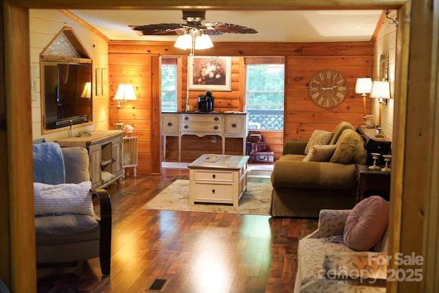 19 Timbers Edge Ln Unit 23, Fairview, NC 28730 - living area featuring dark wood-style floors, ceiling fan, wooden walls, and crown molding