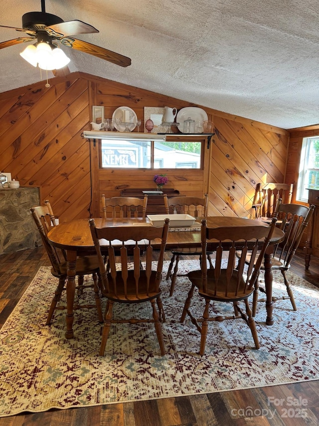 19 Timbers Edge Ln Unit 23, Fairview, NC 28730 - dining area featuring wood walls, lofted ceiling, a textured ceiling, wood finished floors, and ceiling fan