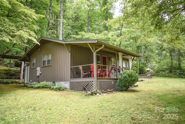 3435 Conleys Creek Rd, Whittier, NC 28789 - view of home's exterior with a porch, a yard, and a view of trees