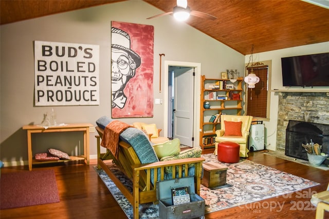 3435 Conleys Creek Rd, Whittier, NC 28789 - sitting room featuring vaulted ceiling, a ceiling fan, wooden ceiling, wood finished floors, and a fireplace
