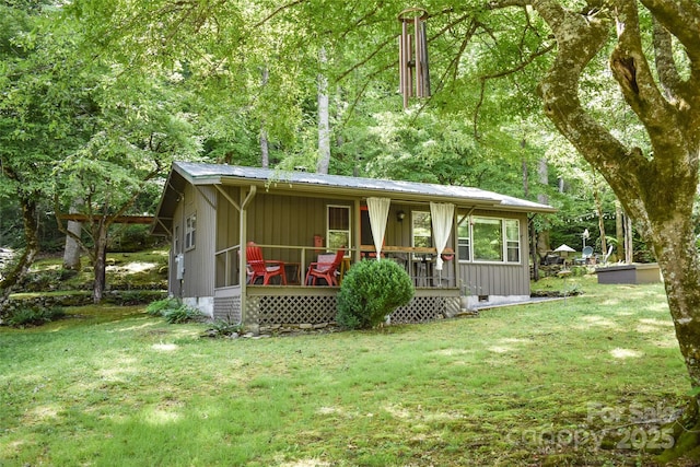 3435 Conleys Creek Rd, Whittier, NC 28789 - view of front of house with a front lawn, covered porch, a metal roof, and crawl space