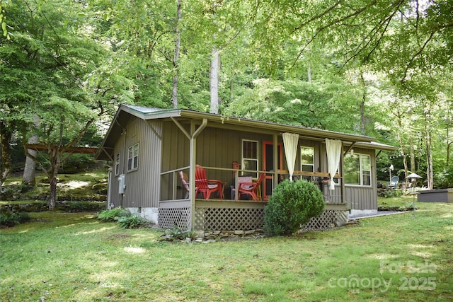 3435 Conleys Creek Rd, Whittier, NC 28789 - view of front facade with a front yard, a porch, and a view of trees