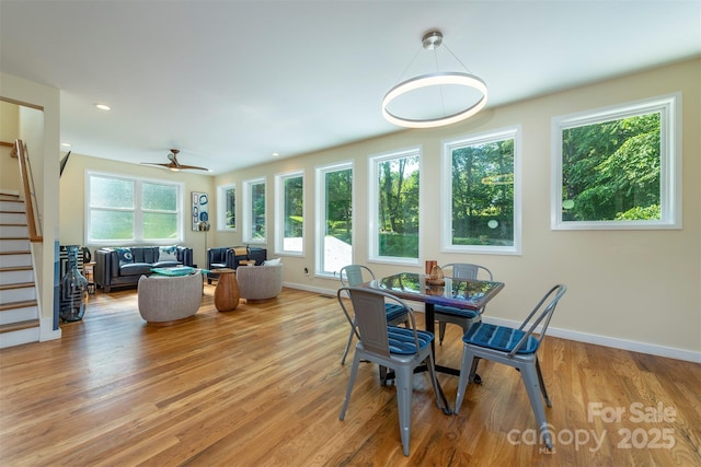 84 W St, Weaverville, NC 28787 - dining room with stairs, light wood finished floors, ceiling fan, and recessed lighting
