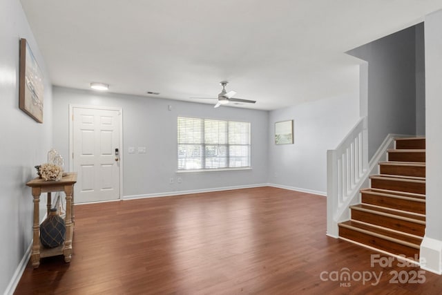 11023 Kinston Ridge Pl, Charlotte, NC 28273 - unfurnished living room with stairway, wood finished floors, and ceiling fan