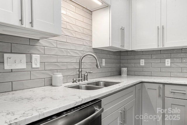 11023 Kinston Ridge Pl, Charlotte, NC 28273 - kitchen with backsplash, light stone countertops, white cabinets, and stainless steel dishwasher