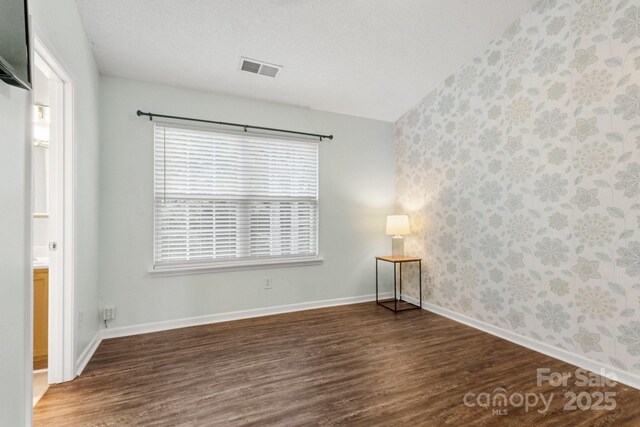11023 Kinston Ridge Pl, Charlotte, NC 28273 - empty room with wood finished floors and wallpapered walls