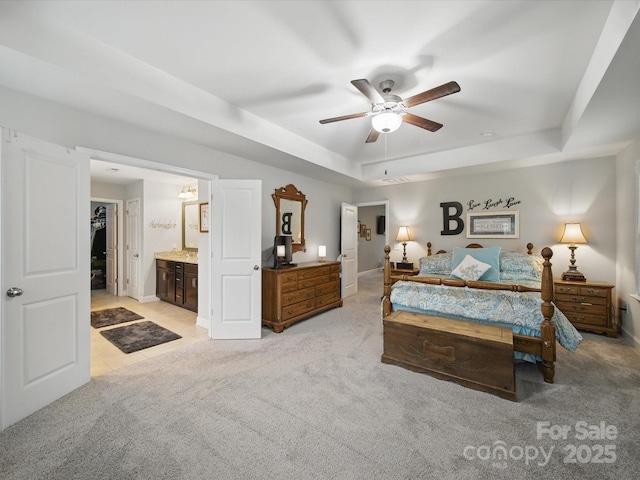 9450 Surface Hill Rd, Mint Hill, NC 28227 - bedroom featuring light carpet, a tray ceiling, a spacious closet, ensuite bath, and a ceiling fan