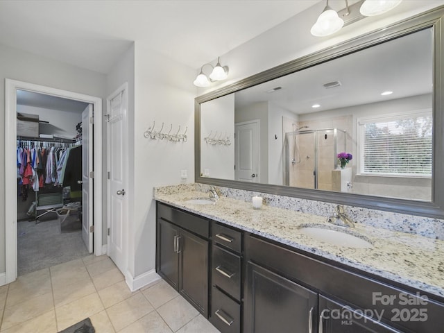 9450 Surface Hill Rd, Mint Hill, NC 28227 - bathroom with a shower stall, double vanity, a spacious closet, and tile patterned floors