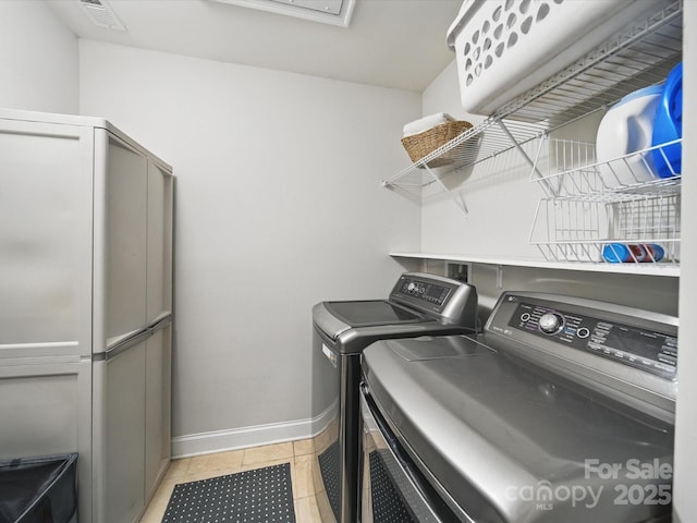 9450 Surface Hill Rd, Mint Hill, NC 28227 - washroom featuring washing machine and clothes dryer and light tile patterned flooring