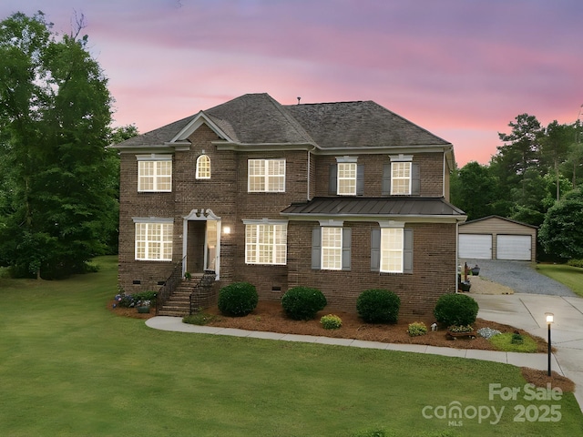9450 Surface Hill Rd, Mint Hill, NC 28227 - view of front of property featuring a detached garage, a yard, brick siding, an outbuilding, and a standing seam roof