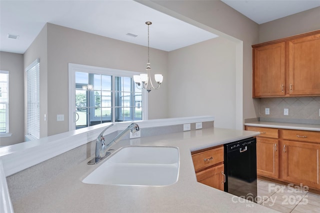 8409 Darcy Hopkins Dr, Charlotte, NC 28277 - kitchen with dishwasher, light countertops, a chandelier, tasteful backsplash, and pendant lighting