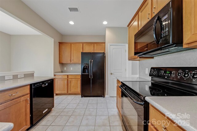 8409 Darcy Hopkins Dr, Charlotte, NC 28277 - kitchen featuring black appliances, backsplash, light countertops, light tile patterned flooring, and recessed lighting
