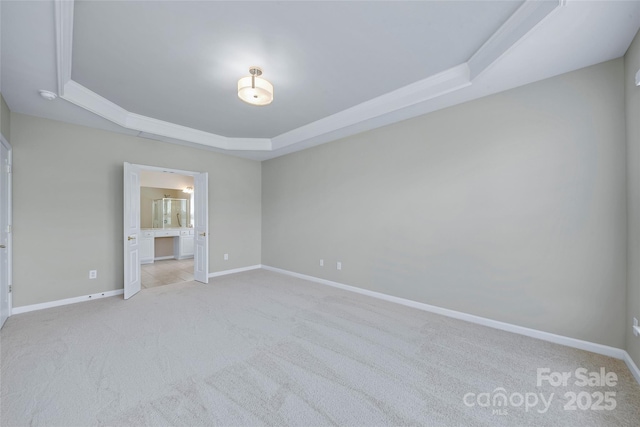 8409 Darcy Hopkins Dr, Charlotte, NC 28277 - unfurnished bedroom with a tray ceiling, light colored carpet, and ensuite bath
