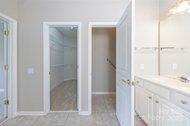 8409 Darcy Hopkins Dr, Charlotte, NC 28277 - bathroom featuring vanity, tile patterned floors, and a walk in closet