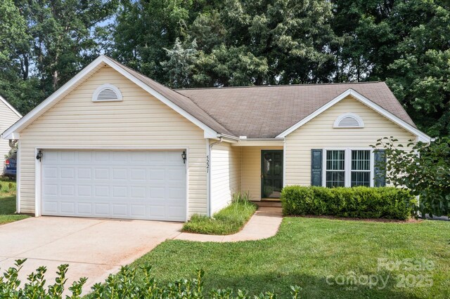 5221 Javitz Rd, Charlotte, NC 28216 - single story home with an attached garage, driveway, a front yard, and a shingled roof