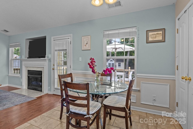 5221 Javitz Rd, Charlotte, NC 28216 - dining space featuring a high end fireplace and tile patterned flooring
