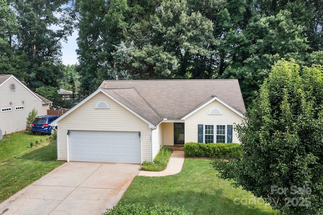 5221 Javitz Rd, Charlotte, NC 28216 - view of front of home with concrete driveway, an attached garage, a front yard, and roof with shingles