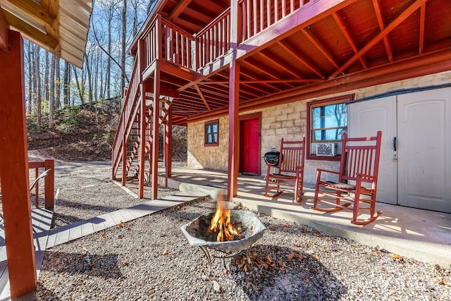 306 Forget Me Not Ln, Whittier, NC 28789 - doorway to property featuring a deck, cooling unit, stone siding, and a patio