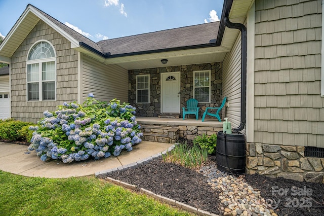 104 Nottingham Dr, Maiden, NC 28650 - property entrance with covered porch, stone siding, and a shingled roof