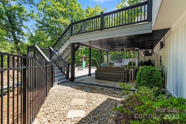 402 Wildlife Rd, Troutman, NC 28166 - view of parking / parking lot with a ceiling fan, stairway, and a fenced backyard
