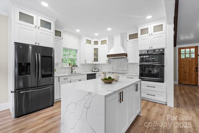 402 Wildlife Rd, Troutman, NC 28166 - kitchen with black appliances, white cabinetry, light wood-type flooring, and recessed lighting