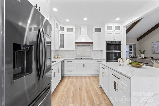 402 Wildlife Rd, Troutman, NC 28166 - kitchen featuring stainless steel fridge, premium range hood, light wood-style floors, backsplash, and recessed lighting