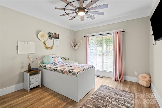 402 Wildlife Rd, Troutman, NC 28166 - bedroom with light wood-style flooring, crown molding, and ceiling fan