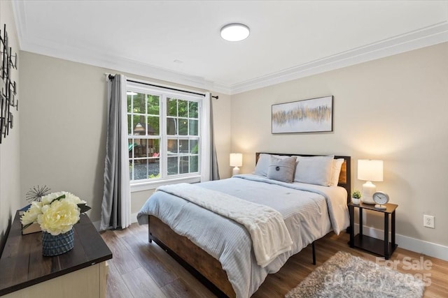 402 Wildlife Rd, Troutman, NC 28166 - bedroom with wood finished floors and crown molding