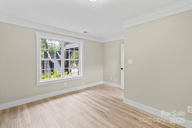 402 Wildlife Rd, Troutman, NC 28166 - spare room featuring light wood-style floors and ornamental molding
