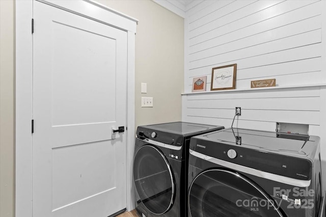 402 Wildlife Rd, Troutman, NC 28166 - laundry area with separate washer and dryer and wood walls