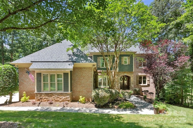 10007 Hillspring Dr, Huntersville, NC 28078 - view of front facade with a front yard, a shingled roof, and brick siding