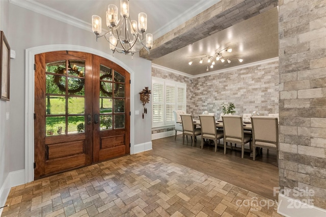 10007 Hillspring Dr, Huntersville, NC 28078 - entrance foyer featuring french doors, a chandelier, and ornamental molding