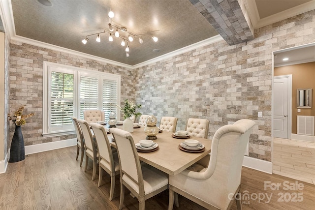 10007 Hillspring Dr, Huntersville, NC 28078 - dining space featuring crown molding and wood finished floors