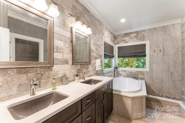 10007 Hillspring Dr, Huntersville, NC 28078 - full bathroom with a bath, ornamental molding, double vanity, tile patterned floors, and tile walls