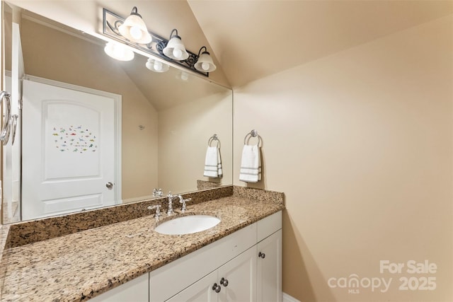 10007 Hillspring Dr, Huntersville, NC 28078 - bathroom featuring vaulted ceiling and vanity