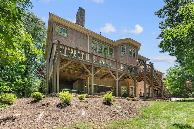 10007 Hillspring Dr, Huntersville, NC 28078 - back of property featuring a wooden deck, stairs, a chimney, and brick siding