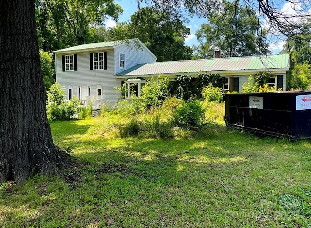 32891 NC-49 Hwy, New London, NC 28127 - back of house featuring a lawn and a metal roof