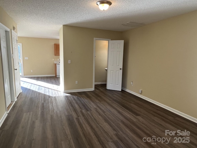 6130 Sid Crane Dr, Charlotte, NC 28216 - unfurnished room featuring dark wood-type flooring and a textured ceiling