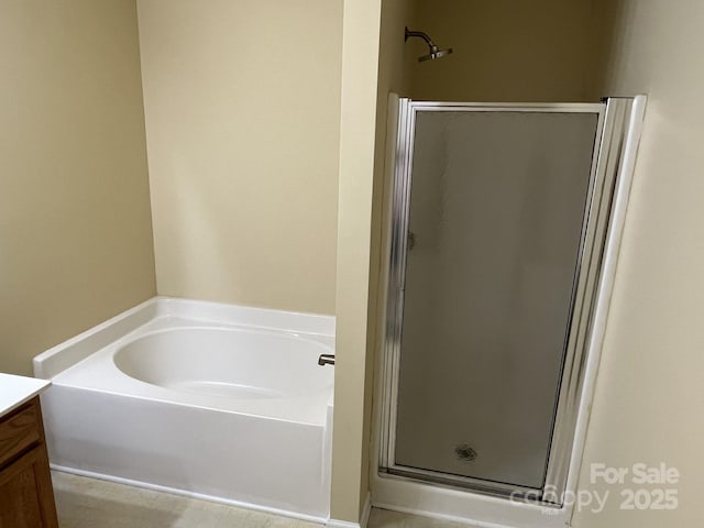 6130 Sid Crane Dr, Charlotte, NC 28216 - full bath featuring vanity, a stall shower, and a garden tub