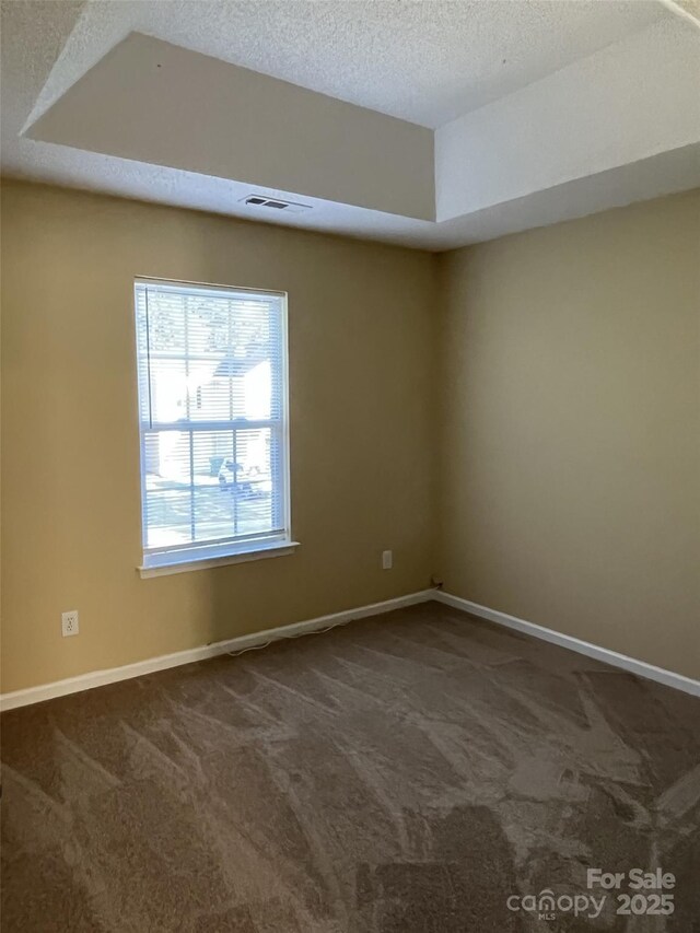 6130 Sid Crane Dr, Charlotte, NC 28216 - empty room featuring dark carpet and a textured ceiling