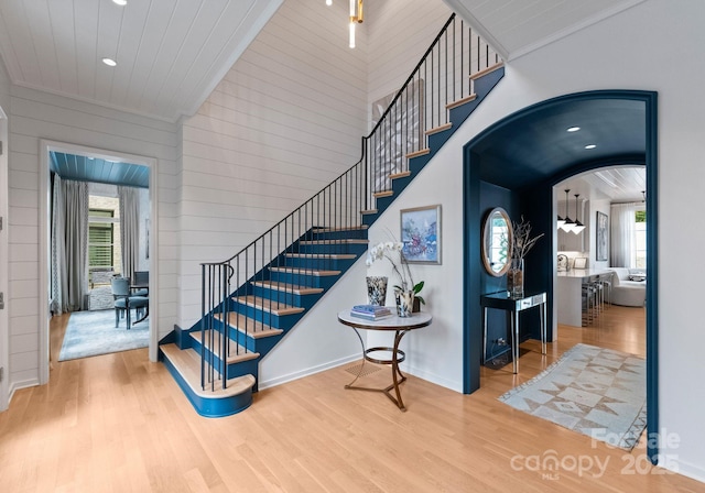 2837 Kenwood Sharon Ln, Charlotte, NC 28211 - stairs with wood finished floors, recessed lighting, arched walkways, and wooden walls