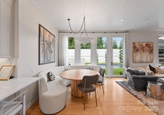 2837 Kenwood Sharon Ln, Charlotte, NC 28211 - dining space with light wood-style floors, wood ceiling, and a water view