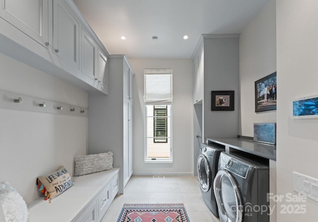 2837 Kenwood Sharon Ln, Charlotte, NC 28211 - washroom featuring washing machine and clothes dryer, cabinet space, light tile patterned floors, and recessed lighting