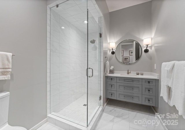 2837 Kenwood Sharon Ln, Charlotte, NC 28211 - bathroom with vanity, marble look tile flooring, and a stall shower