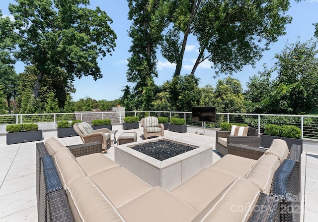 2837 Kenwood Sharon Ln, Charlotte, NC 28211 - view of patio with an outdoor living space with a fire pit and view of wooded area