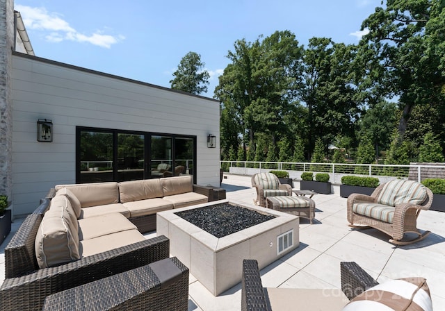 2837 Kenwood Sharon Ln, Charlotte, NC 28211 - view of patio / terrace with an outdoor living space with a fire pit