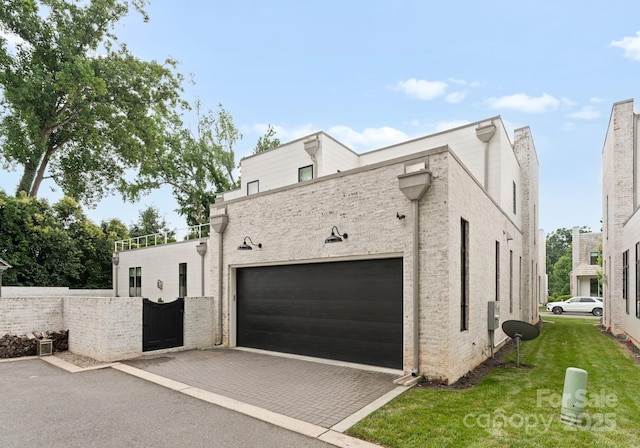 2837 Kenwood Sharon Ln, Charlotte, NC 28211 - view of side of property featuring decorative driveway, a garage, and a yard